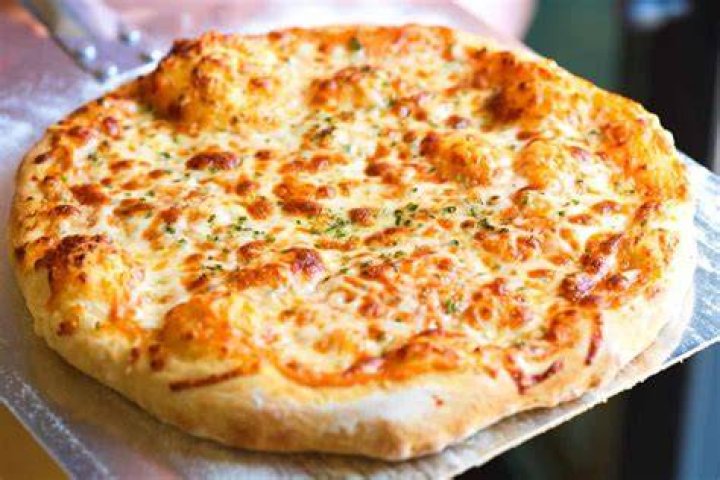 How can I make my pizza more flavorful?