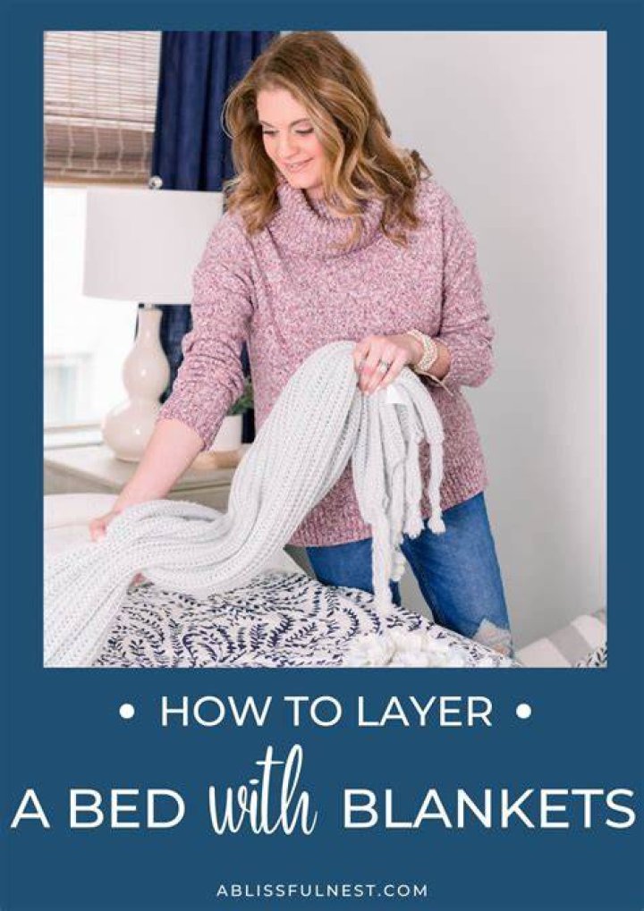 How do you layer an electric blanket on a bed?