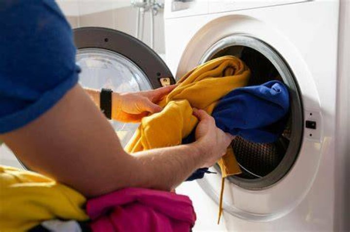 Why do my clothes feel waxy after washing?